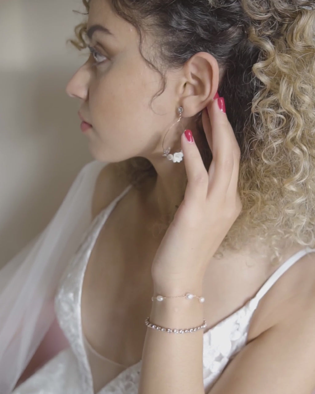 Video of a bride wearing the Astra Double Strand Bridal Bracelet in rose gold.