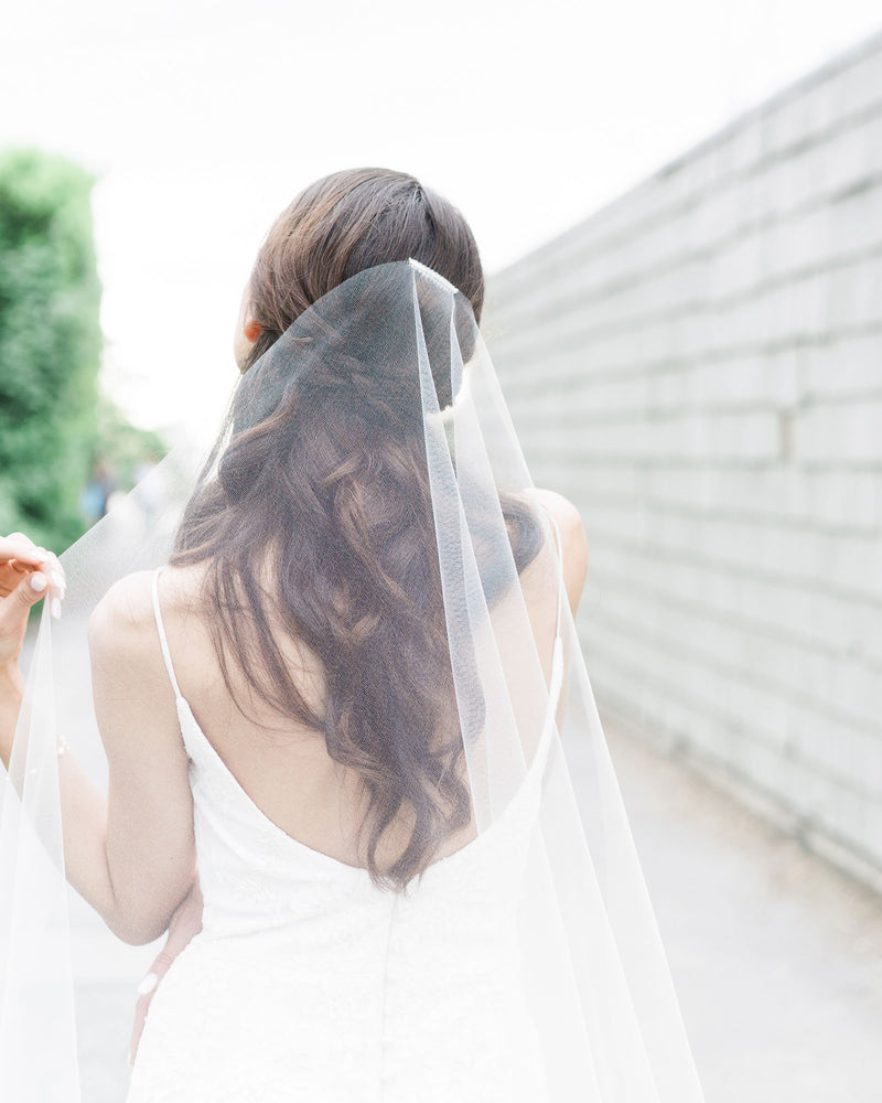 Close model view of the hand-cut edge on the Senna Lace Veil.