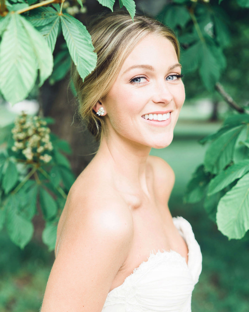 Bride wearing the Starlight Bridal Earrings with pearls and crystals.
