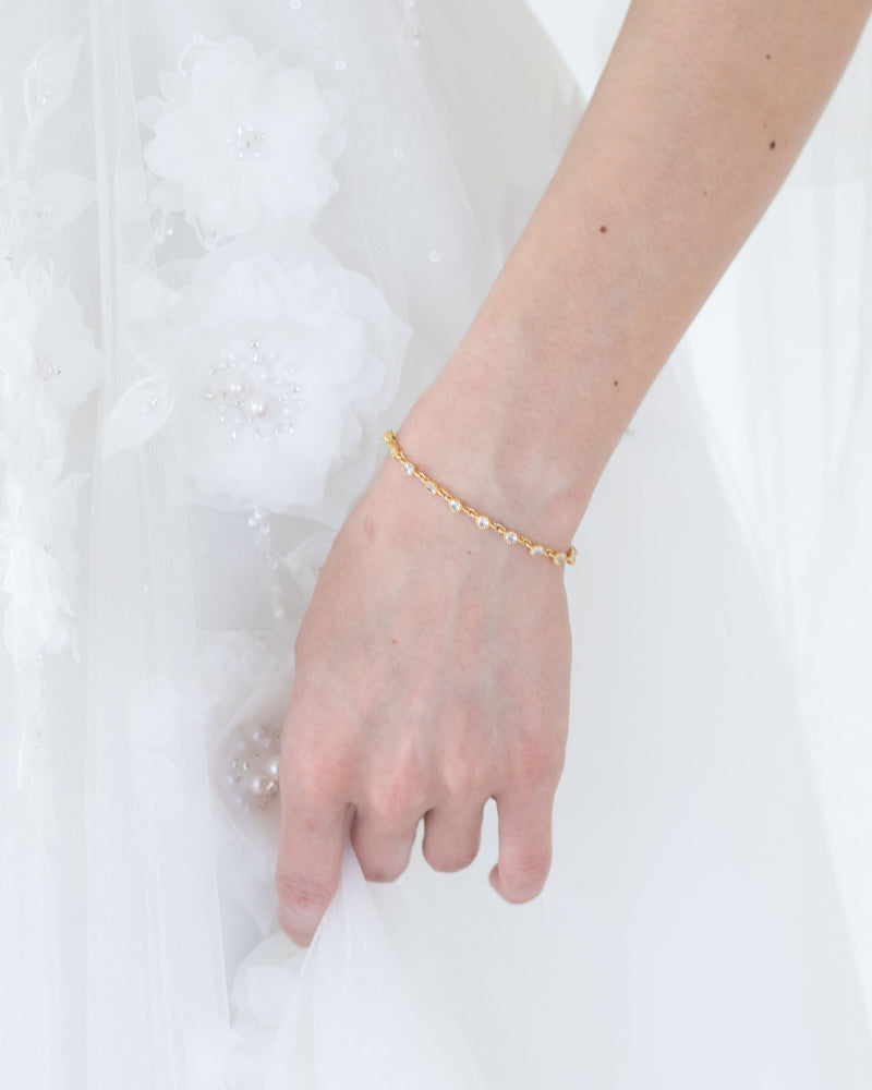 A model wears the Glitz Classic Bridal Bracelet in gold.