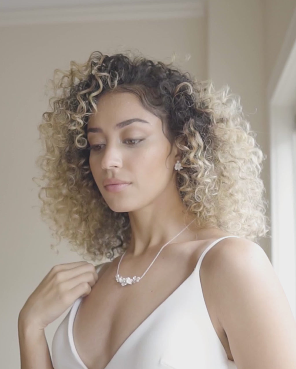 Video of a model wearing the Belle Fleur Necklace paired with the Belle Fleur Cluster Earrings.