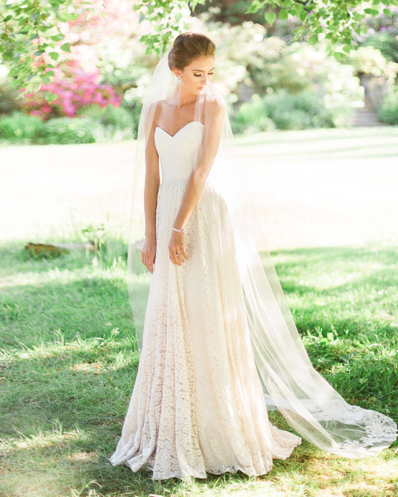 Model wearing Whispering Roses Beaded Lace Chapel bridal Veil