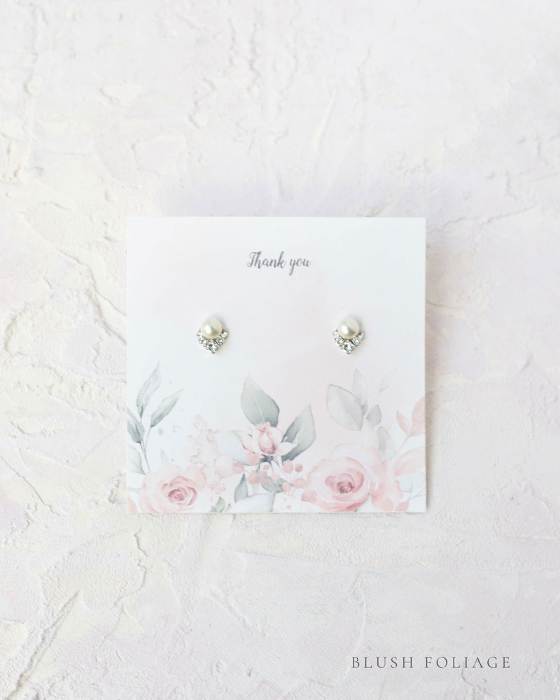 Flatlay of a custom jewellery insert option for our Luxe Gift Wrapping; blush foliage.