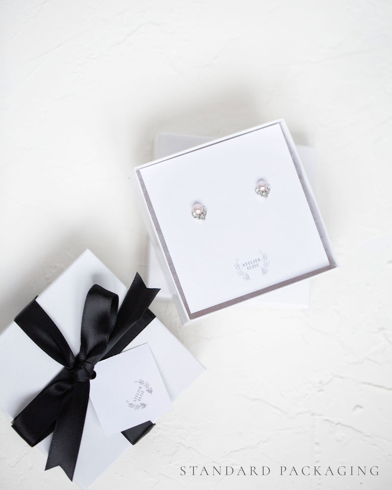 An example of our standard jewellery box packaging, complete with black satin bow.