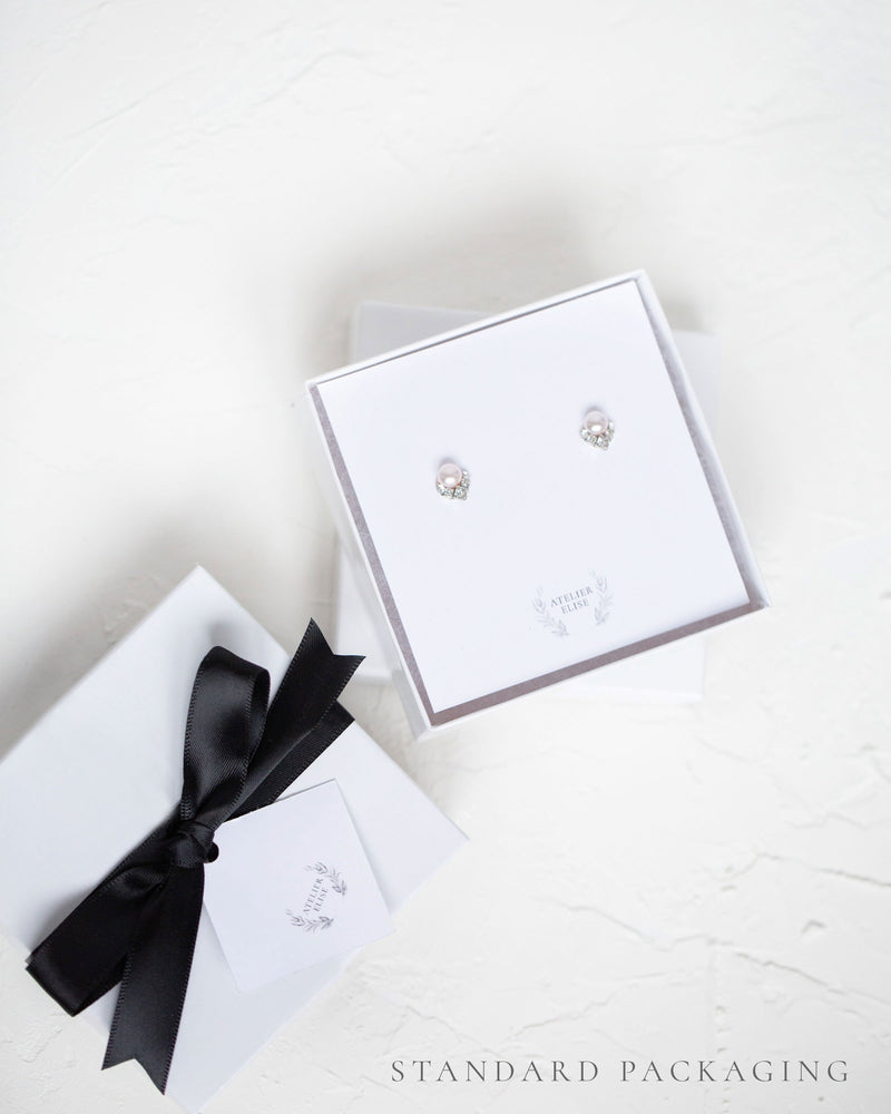 An example of our standard jewellery box packaging, complete with black satin bow.