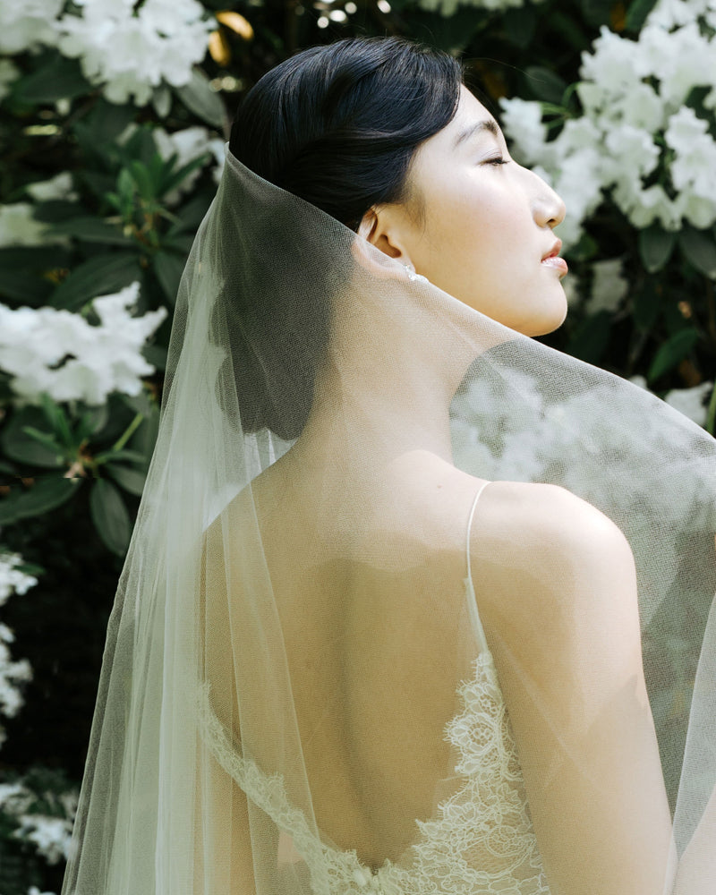 Close-up of a bride wearing the Azalea two-layer veil without gathers.