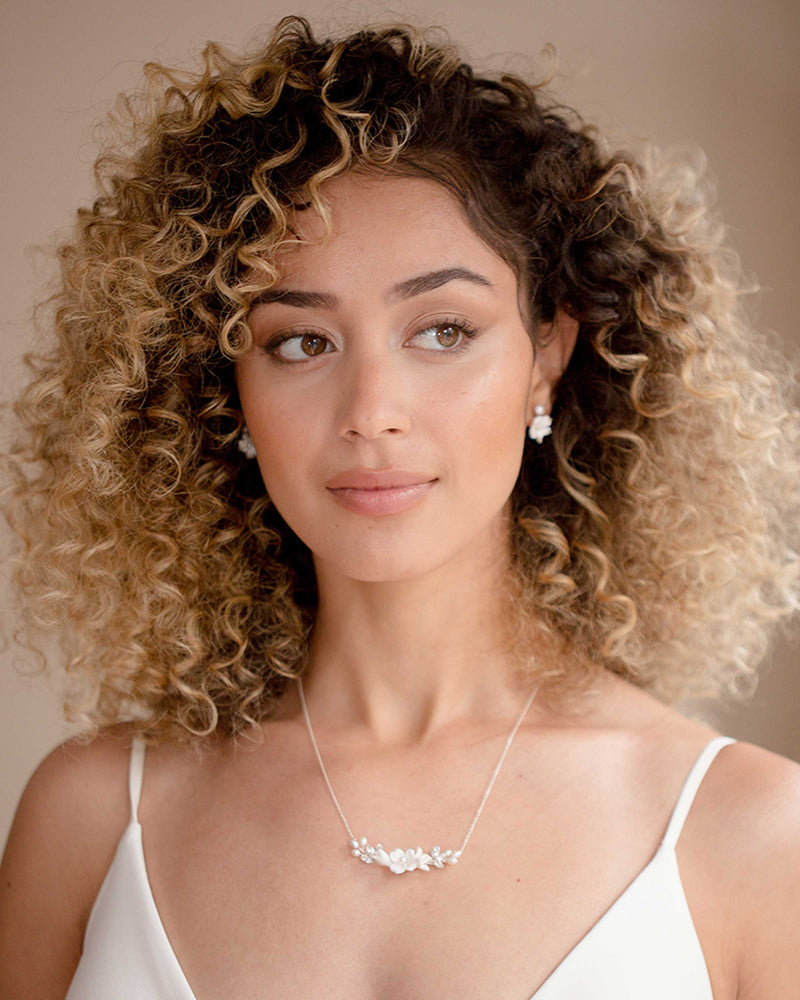 A model wears the Belle Fleur Cluster Earrings with the Belle Fleur Necklace.