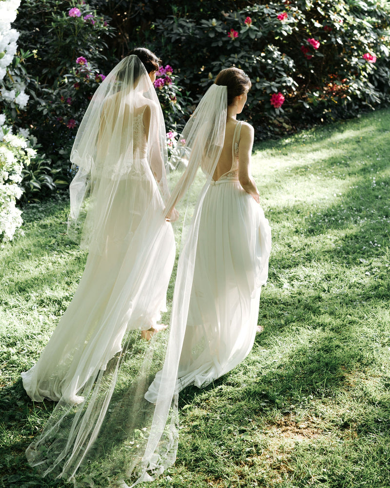 Model wearing cascading leaves long tulle wedding veil 