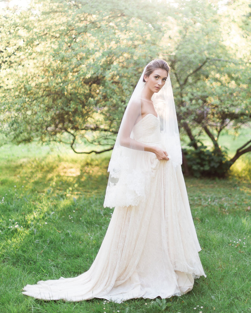 model wears short bridal veil with blusher