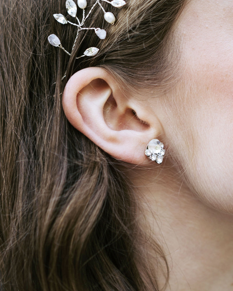 Close-up of model wearing Celestial Crystal Stud Bridal Earrings in silver.