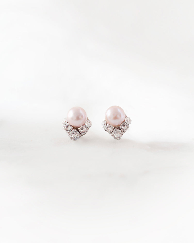A close-up product view of the Celestial Pearl Cluster Earrings in silver with blush freshwater pearls.