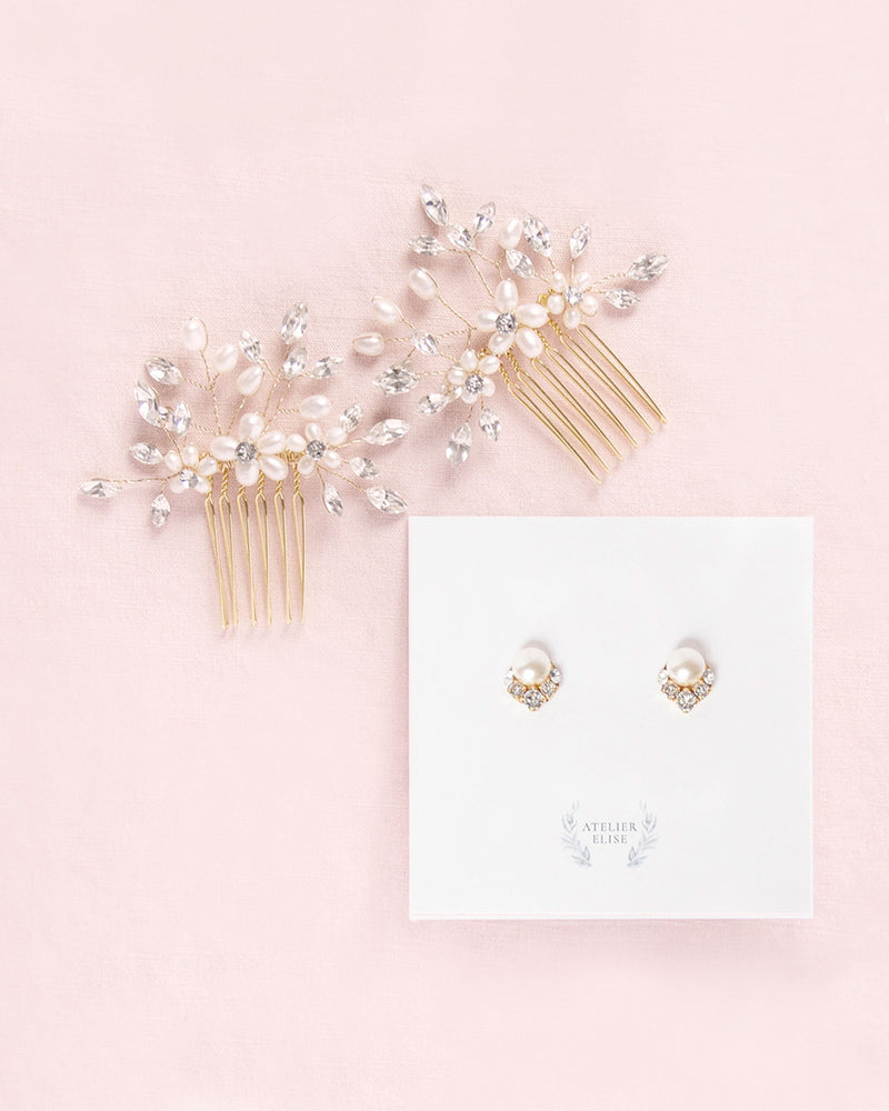 Flatlay of a pair of Delicate Combs in gold with pearls and crystals. Paired alongside the Celestial Pearl Cluster Earrings in gold with cream pearls.