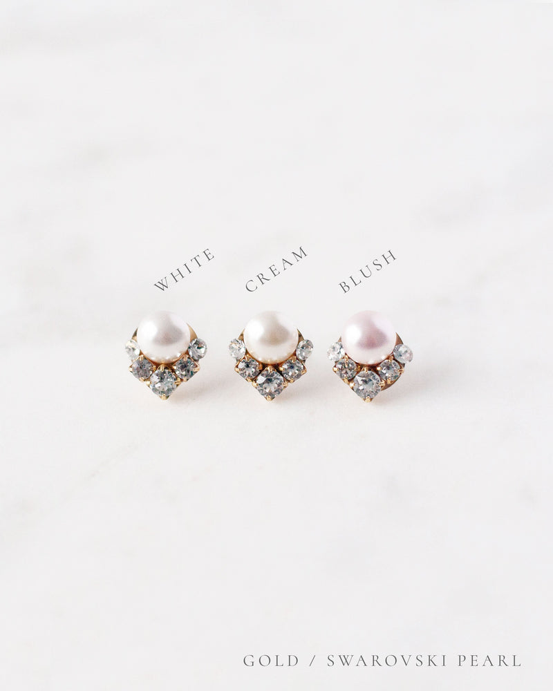 A side-by-side view of the faux pearl color options, all shown with gold settings.