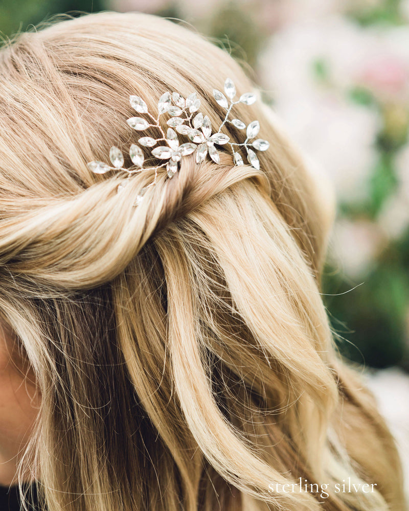A close model view of the Everthine Crystal Hair Pins. The model's hair is styled into a bridal updo of soft waves, with the sides pinned back.
