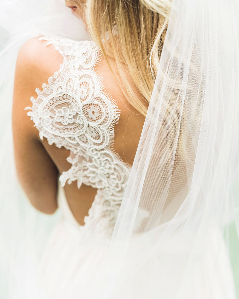 Close details of a bride wearing the Lily Veil.