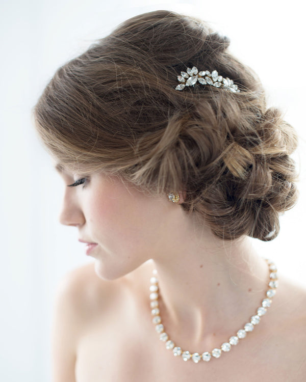 A model wears the Lotus Flower Crystal Comb in her low bridal updo.