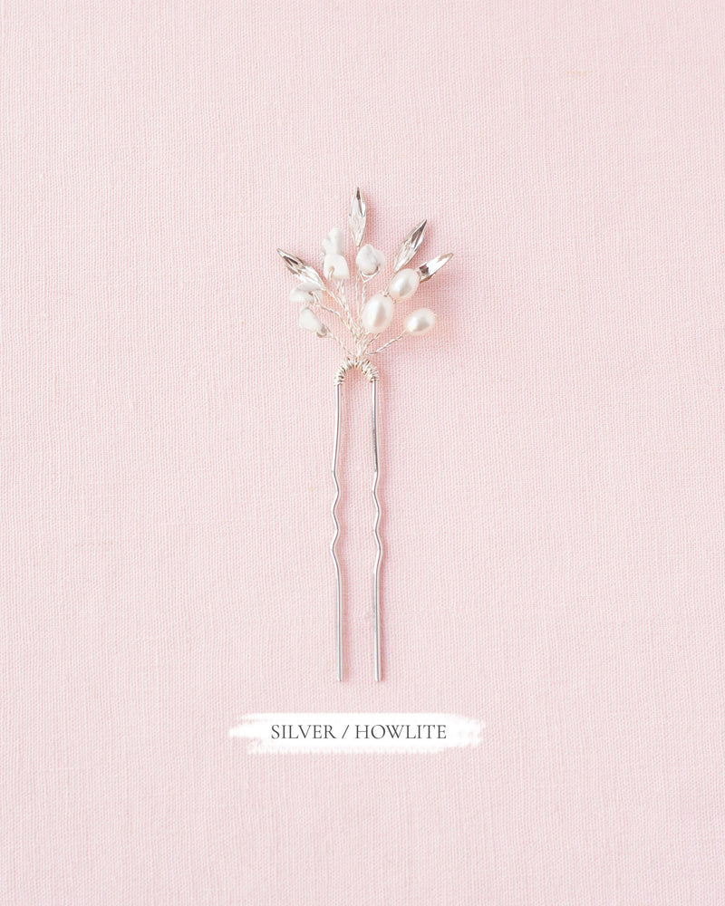 Flatlay of the Sea Mist Bridal Hair Pin in silver with howlite, pearls, and crystals.
