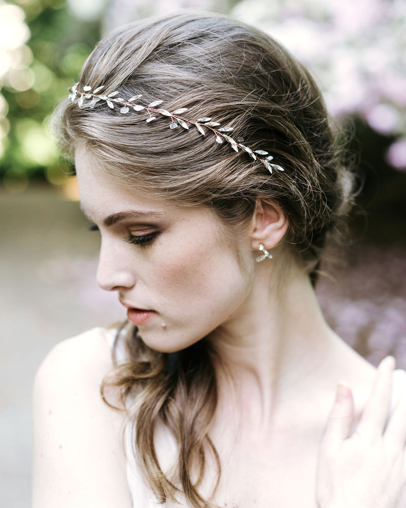 A bride wears the Sea Mist Hair Vine in rose gold with moonstone, and crystals.