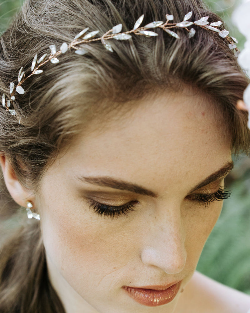 Close on model details of the Sea Mist Bridal Hair Vine with moonstone and crystals.