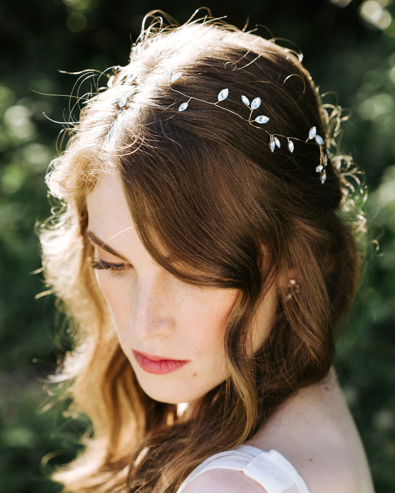 A bride wears the Sparkling crystal hair vine in gold.
