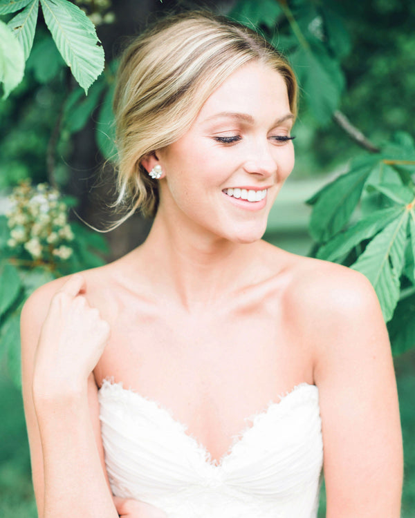 Bride wearing the Starlight Bridal Earrings with pearls and crystals.