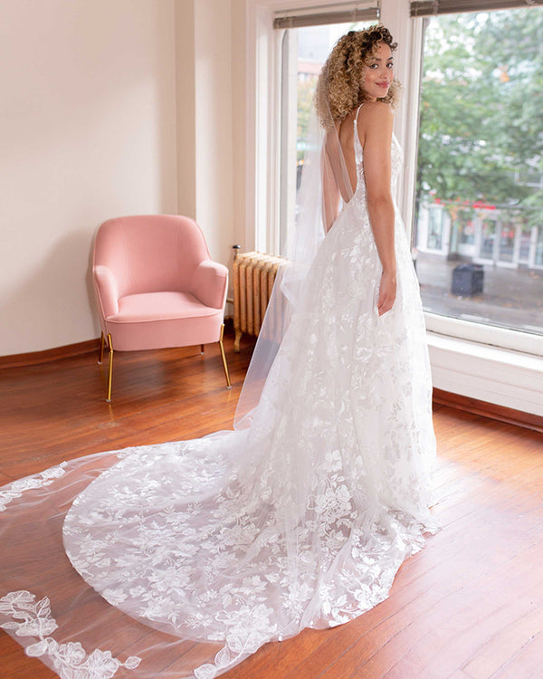 A bride wears the Zinnia Lace and Horsehair Veil in extended chapel length over a lace A-line Made with Love gown.